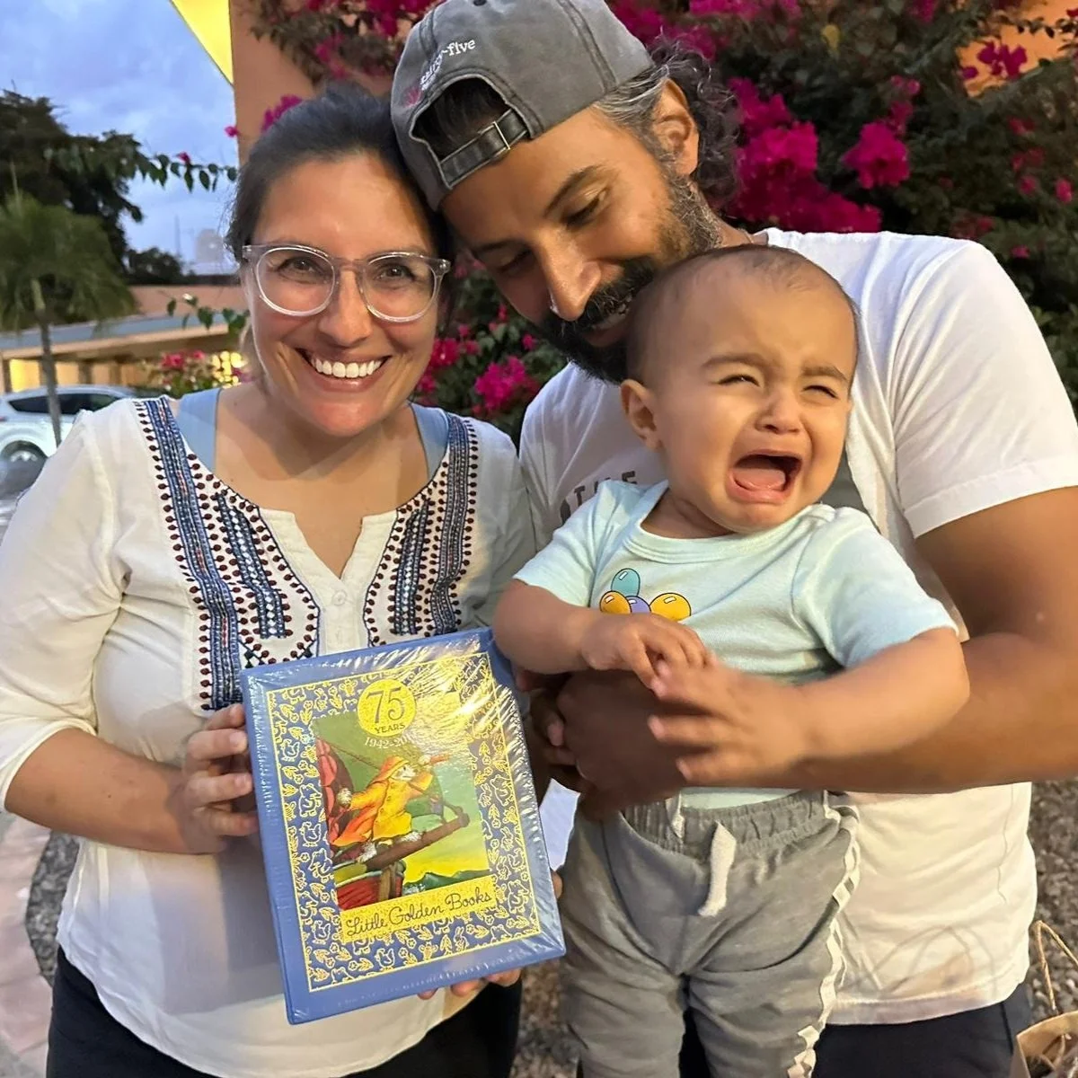 Family photo with a stack of Little Golden Books.