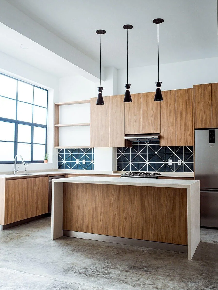Casa Viva kitchen with wood cabinets and blue tile backsplash